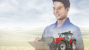   Two farmers reviewing information on tablet