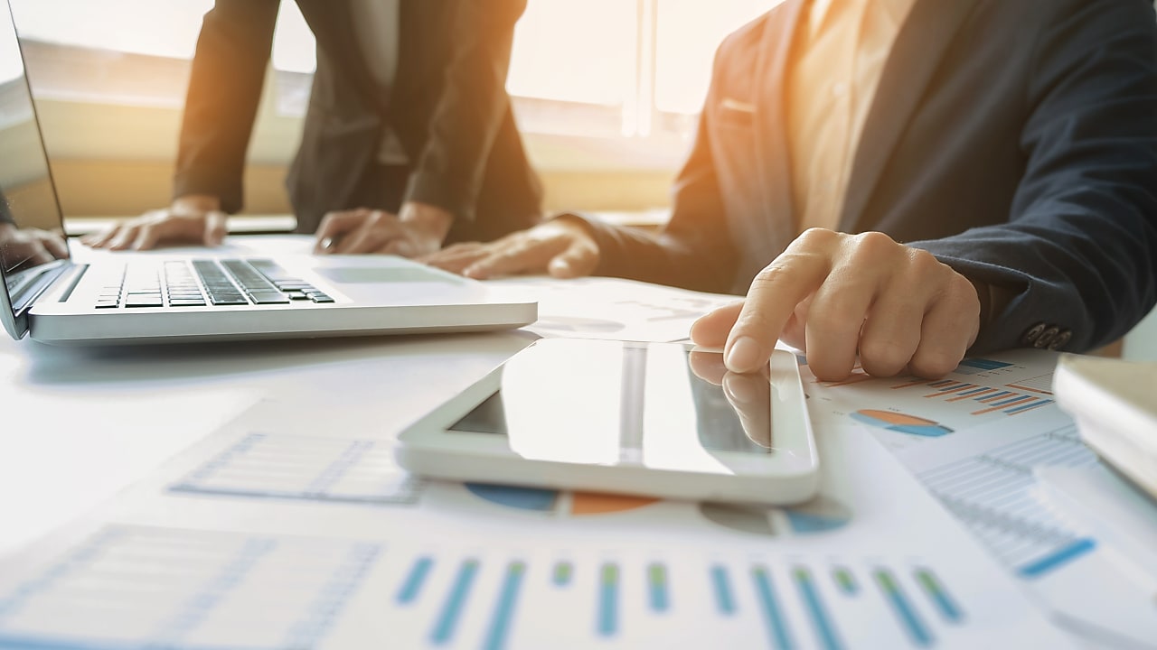 A person on a laptop and touchpad