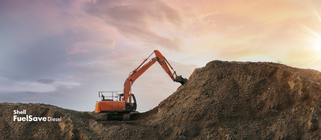Digger scooping up dirt