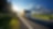 White truck arriving on the asphalt road in rural landscape in the rays of the sunset