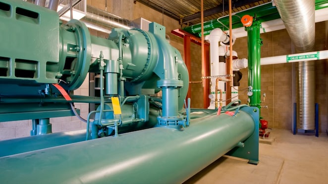 Large pump and screw compressor for an industrial HVAC system