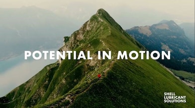 Aerial view of person running on the mountain ridge