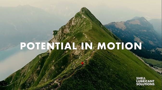 Aerial view of person running on the mountain ridge