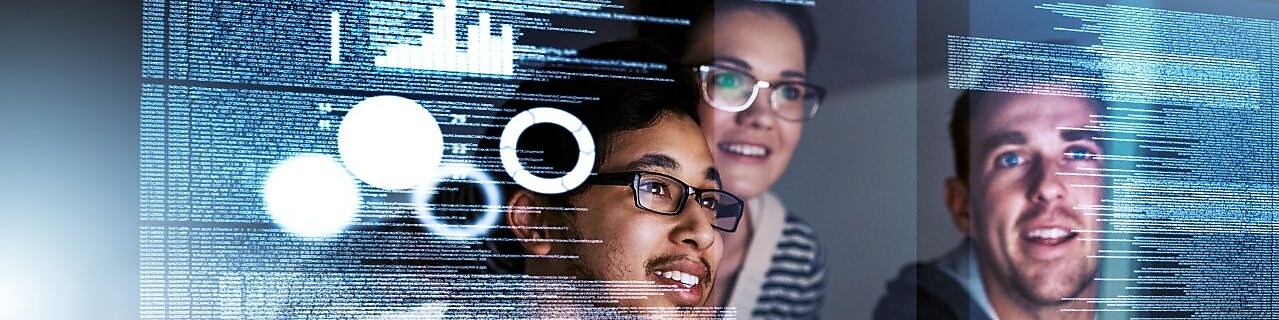 A group of experts analyse code and data on a screen