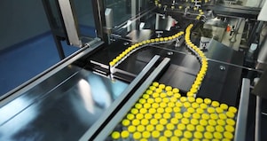 Products being manufactured by automated machinery.