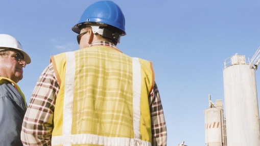 Men talking at a cement plant