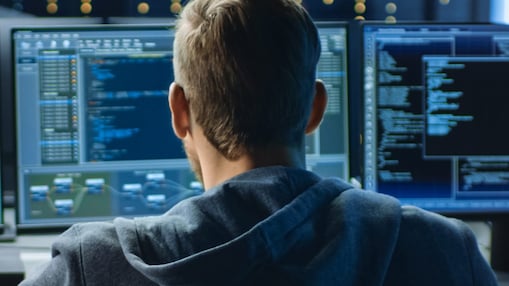 a man looking at computer screen