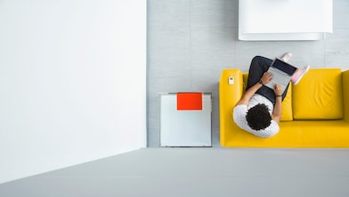 Person relaxing on a sofa in the office