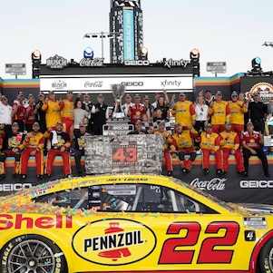 Logano celebrates victory with crew