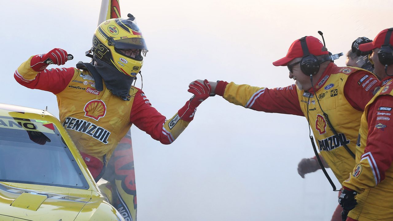Logano celebrates victory with team