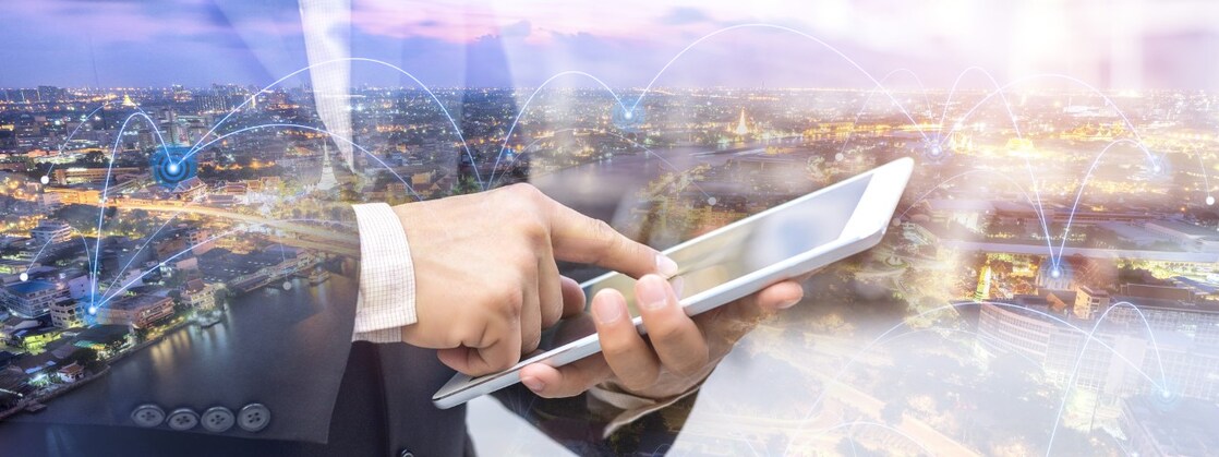 Background of city and image of man and ipad on front