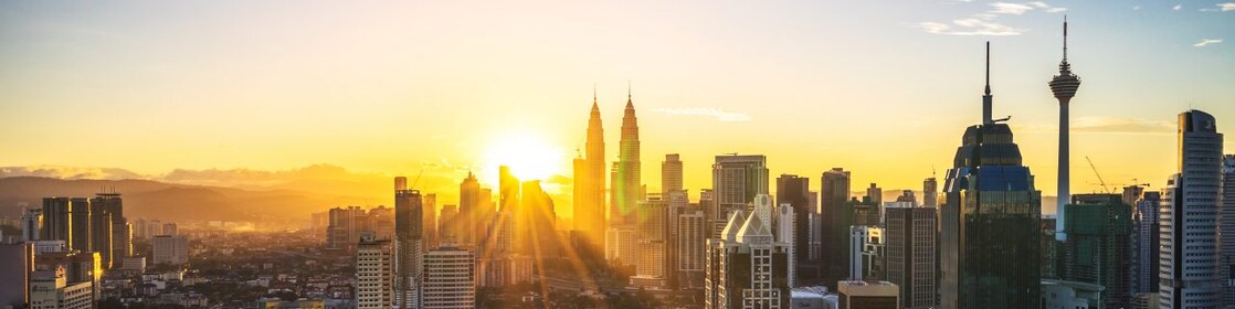 Sun rising in city landscape