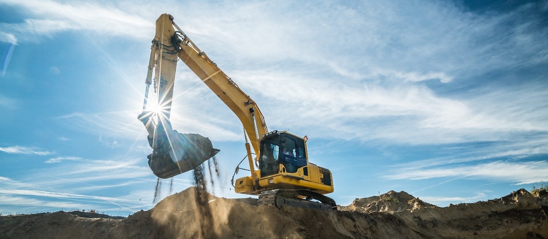 Yellow digger on a mound 