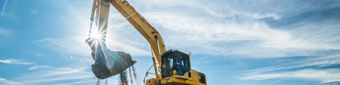Yellow digger on a mound 