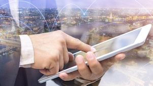 Background of city and image of man and ipad on front