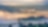 An image of green hills and fog