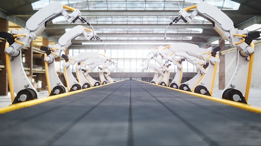 Wielding robots  and conveyor belt in automated factory