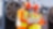 2 builders in hardhats staring at a laptop