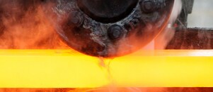 Steel worker mixing melted steel
