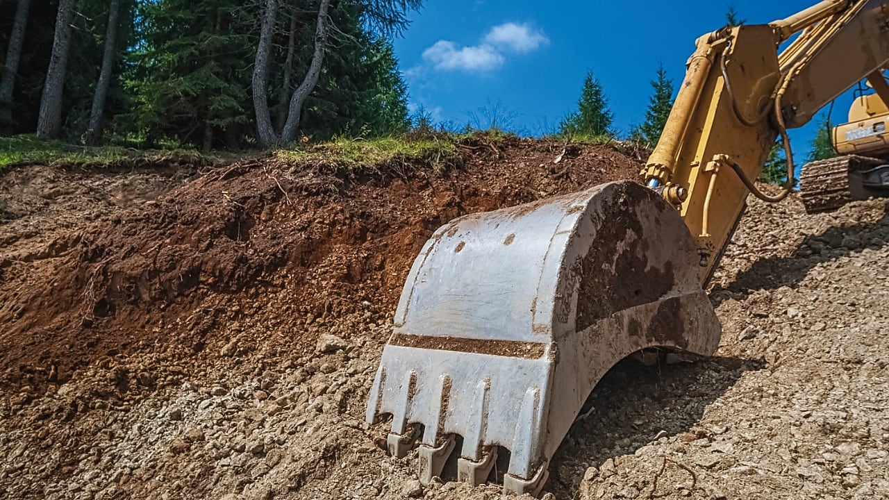 Excavator working on land