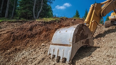 Excavator working on land