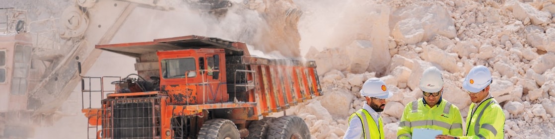 Workers and equipment at cement quarrying site