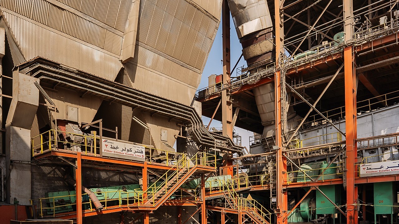 Shell workers standing infront of cement plant