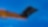 A yellow digger pointing up into a blue sky