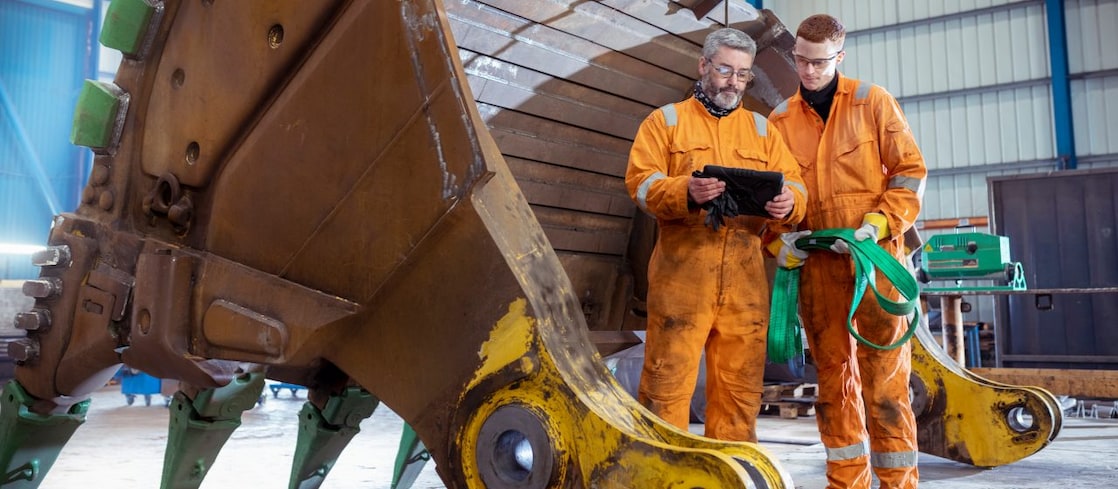 Two engineers looking at tablet