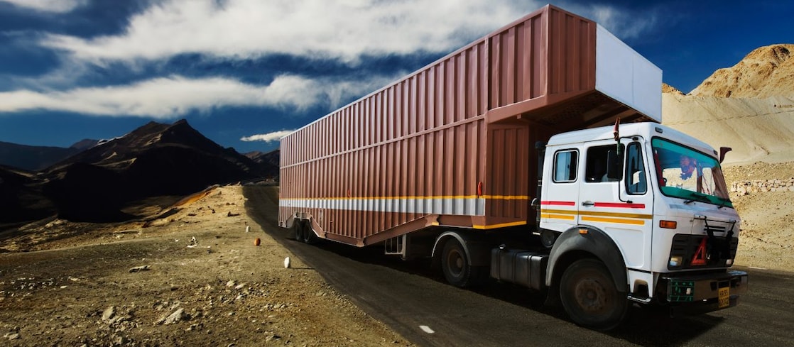 Large truck driving through sandy roads