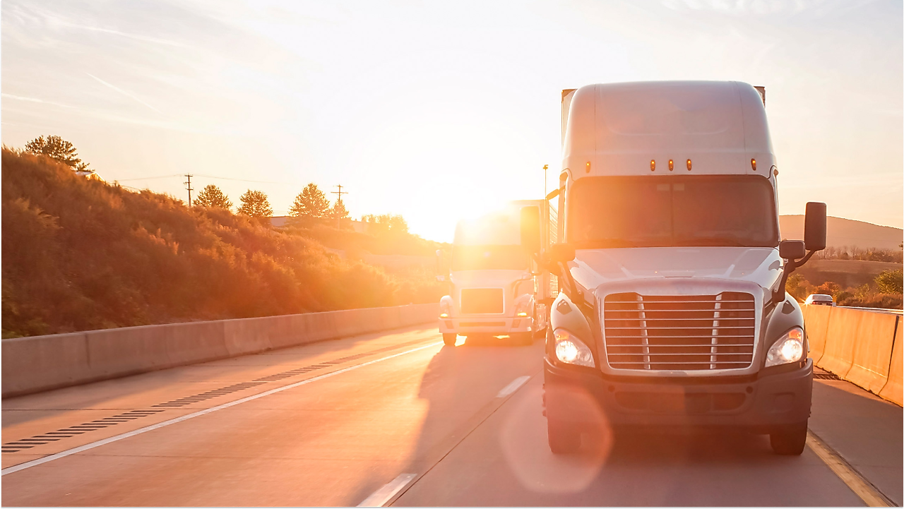 Truck driving in sunlight