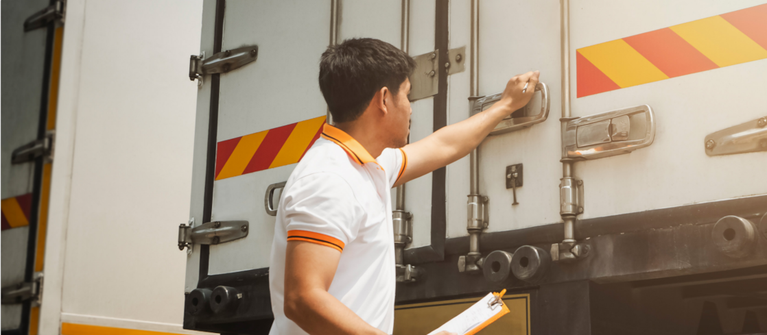 Employee closing truck door