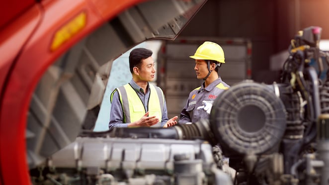 Two men discussing work