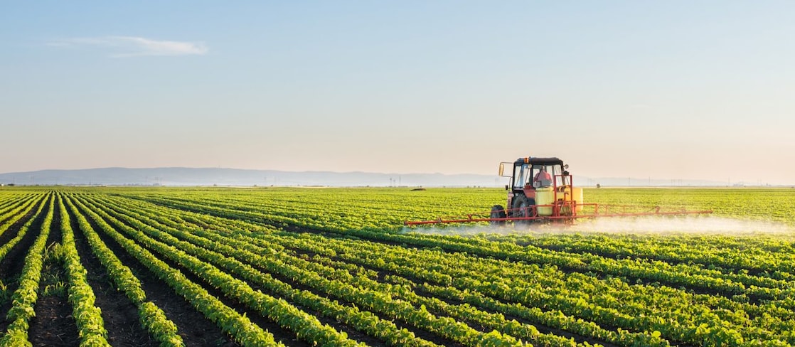 Tractor working in field