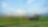 Tractor pulling machinery in green field