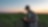 Farmer looking at tablet in field of crops