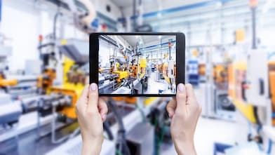 Plastic injection moulding equipment viewed on ipad screen