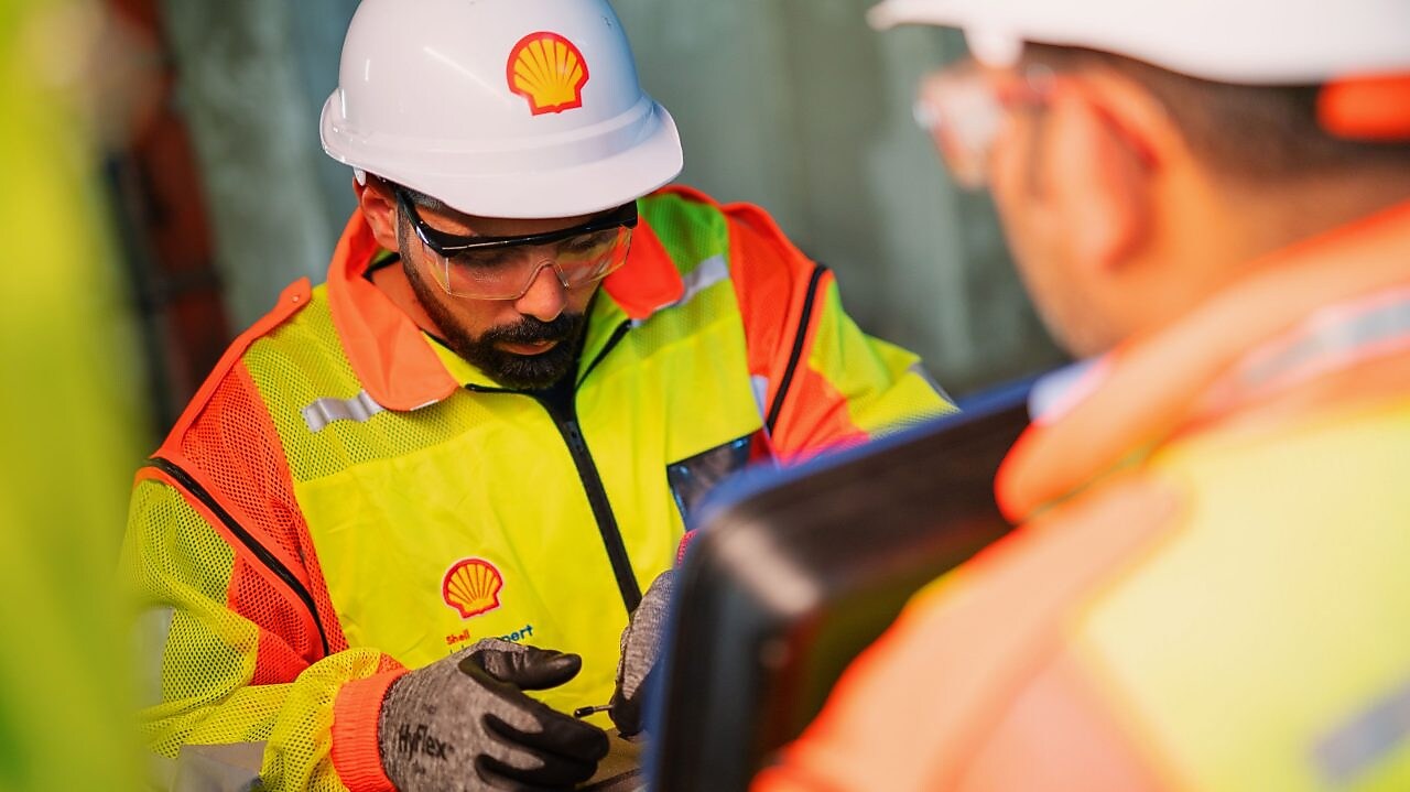 Shell maintenance team working in robotics manufacturing plant
