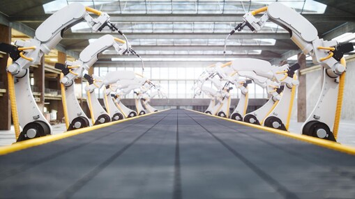 Series of robotic arms on assembly line
