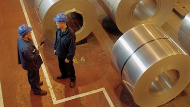 Workers with metal reels
