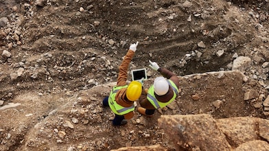 Two workers at mining site