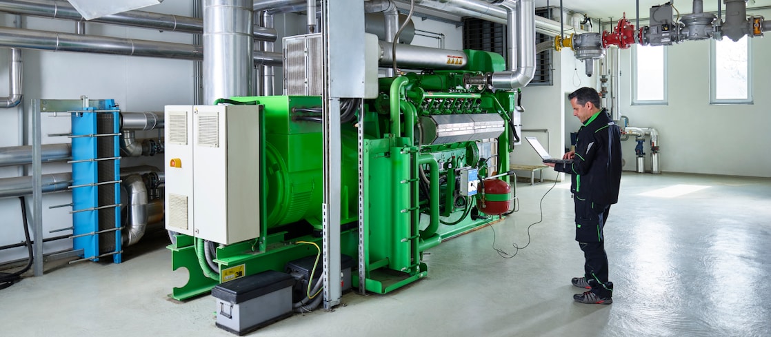 Close up of green pipes from a gas engine