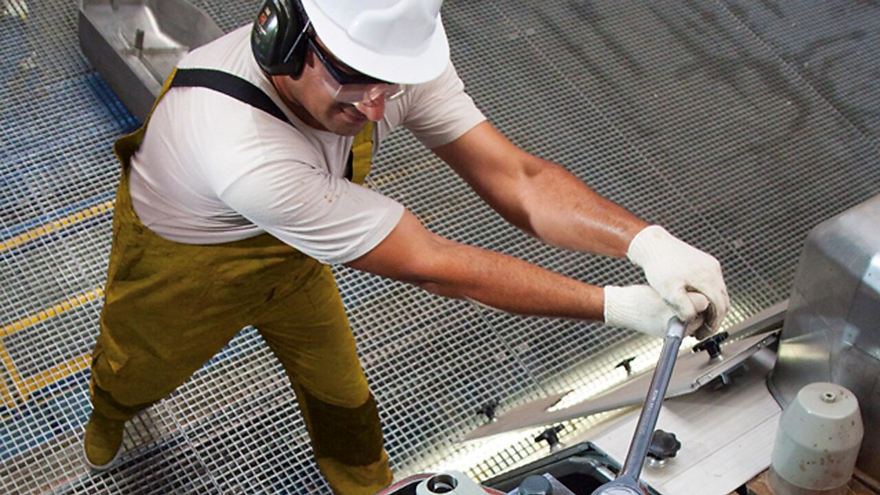 Engine operator working on equipment