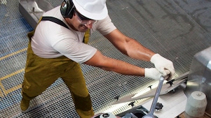 Engine operator working on equipment