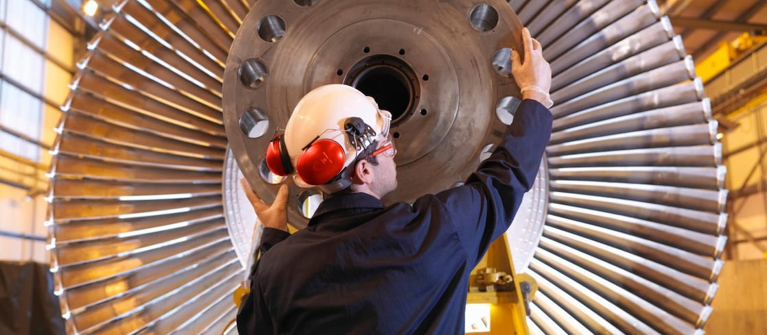 Engineer Inspecting Turbine
