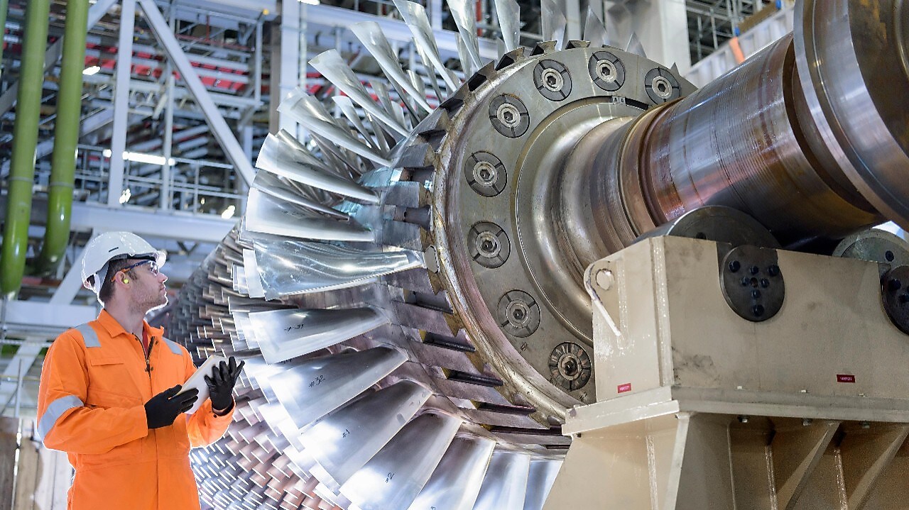 Gas turbine under repair in gas-fired power station.