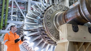 Gas turbine under repair in gas-fired power station.