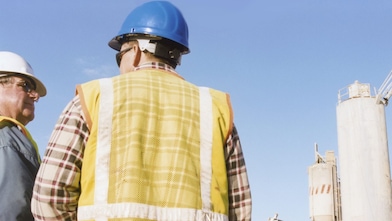 Men talking at a cement plant