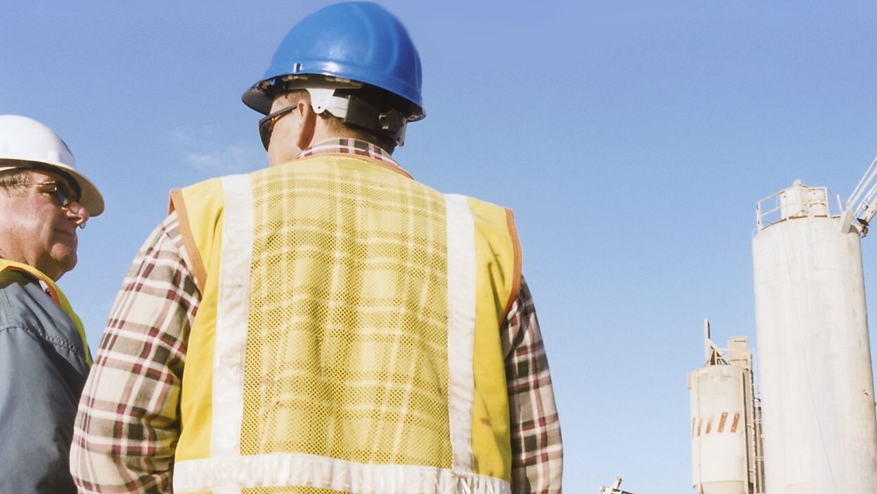 Men talking at a cement plant