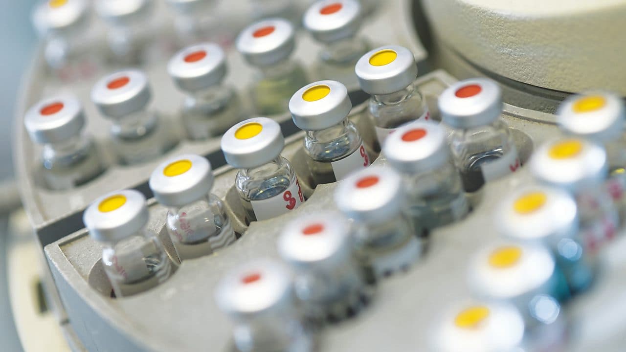 Vials of samples on an auto sampler